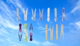 Clothes pegs against a sky background