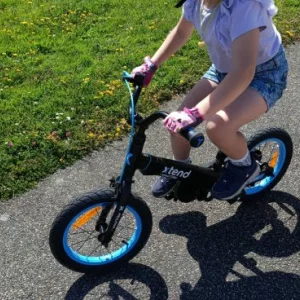 A child using the smarTrike Xtend 3-Stage Bicycle as a pedal bike