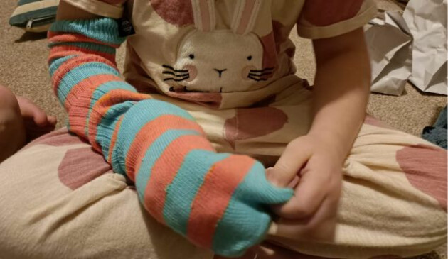 A child playing The Sock Game