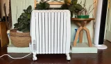 De'Longhi Dragon 4 Oil-Filled Radiator being hand tested by journalist Poppy O'Neill
