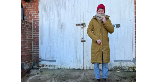 Mumsnet journalist Poppy O'Neill hand-testing the Seasalt Janelle coat