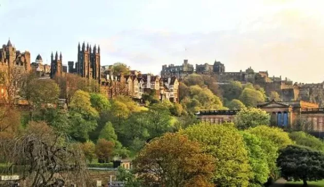 a view of Edinburgh showing trees and historic buildings