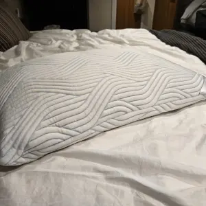 The TEMPUR Cloud SmartCool Pillow on the tester's bed