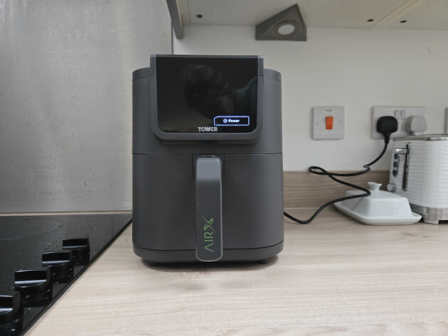 Tower AirX AI 5L air fryer on a kitchen worktop, showing the slimline design and front touchscreen display.