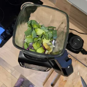 The Ninja Foodi Blender and Soup Maker filled with soup ingredients, viewed from above