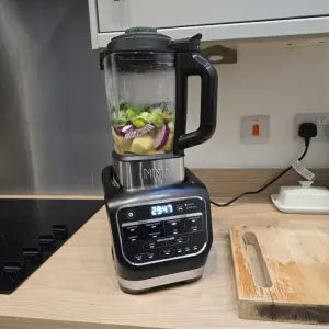 The Ninja Foodi Blender and Soup Maker filled with soup ingredients