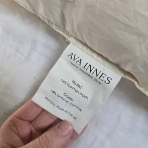 Close up of the Ava Innes Luxury Wool & Organic Cotton Bed Pillow label