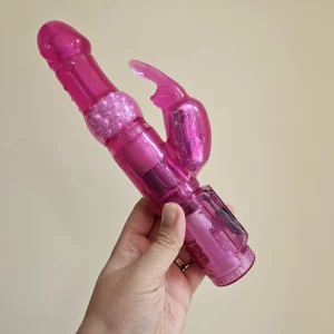 A hand holding the Lovehoney Jessica Rabbit 10 Function Rabbit Vibrator