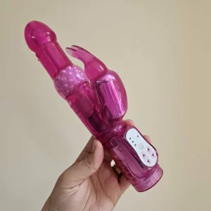 A hand holding the Lovehoney Jessica Rabbit 10 Function Rabbit Vibrator