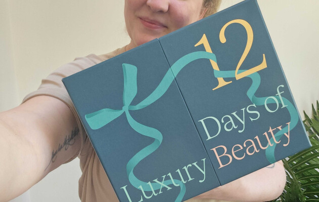 Mumsnet editor Rebecca holding the Boots 12 Days of Luxury Beauty Advent calendar