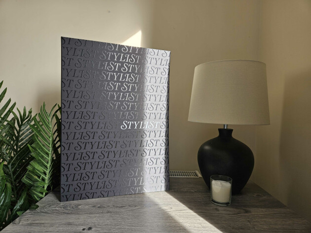 The Latest in Beauty x Stylist beauty advent calendar placed a top a table with the sun shining on it