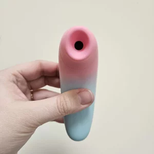 A hand holding the Lovense Tenera 2