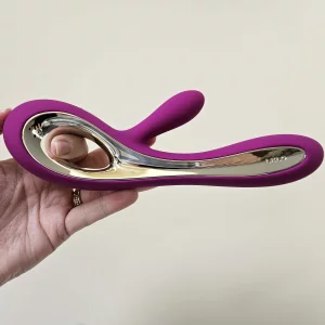 A hand holds the LELO SORAYA 2 Rechargeable Rabbit Vibrator horizontally for a sideways view