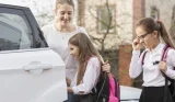 Woman dropping off kids at school