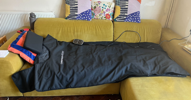 Mumsnet editor Poppy O'Neill testing the CurrentBody Infrared Sauna Blanket