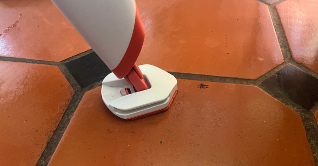 Mumsnet home editor Poppy O'Neill testing the OXO Good Grips Microfibre Spray Mop