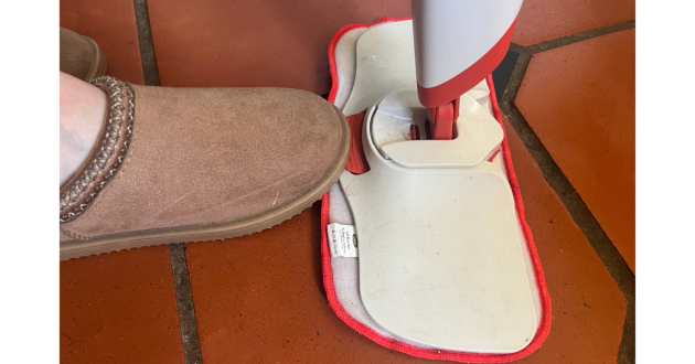 Mumsnet home editor Poppy O'Neill testing the OXO Good Grips Microfibre Spray Mop
