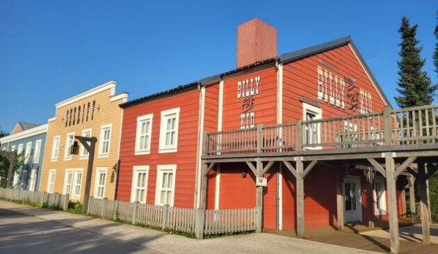 The grounds of Hotel Cheyenne featuring three buildings in the style of the Wild West