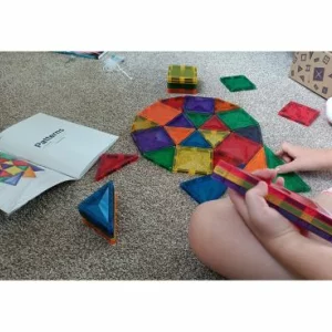 A child playing with Connetix tiles