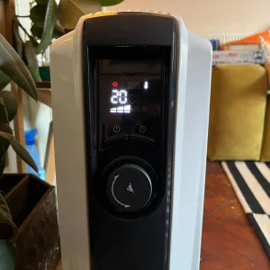 De'Longhi Dragon 4 TRDX41025E Oil Filled Radiator being hand tested by journalist Poppy O'Neill