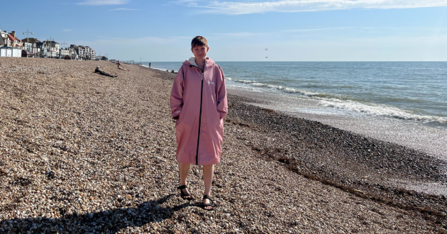 Journalist Poppy O'Neill testing the Two Bare Feet Elemental Changing Robe in the English Channel
