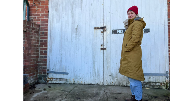 Mumsnet journalist Poppy O'Neill hand-testing the Seasalt Janelle coat