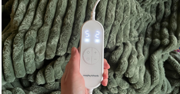 Mumsnet journalist Poppy O'Neill testing the Morphy Richards EverCosy Luxury Striped Heated Throw