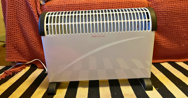 Mumsnet journalist Poppy O'Neill hand testing the Daewoo Convector Heater