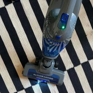 Mumsnet journalist Poppy O'Neill testing the Russell Hobbs Centaur 2 in 1 Cordless Vacuum