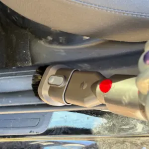 Mumsnet journalist Rachel Erdos testing the Dyson Car+Boat Handheld Vacuum Cleaner