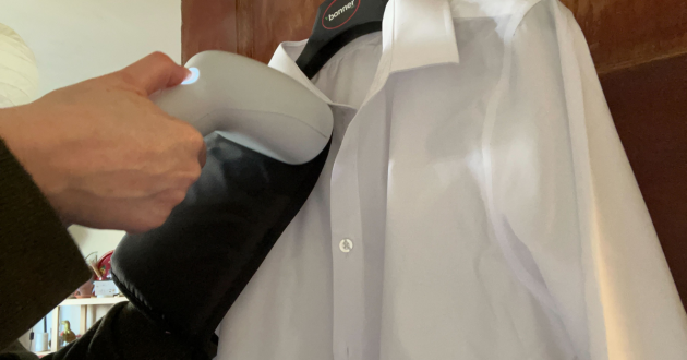 Mumsnet journalist Poppy O'Neill testing the Steamery Cirrus X Handheld Steamer