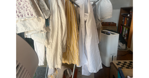 Mumsnet Home editor Poppy O'Neill hand testing the Blyss 16L Dehumidifier WDH-316DB