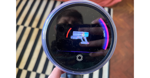 Mumsnet home editor Poppy O'Neill testing the Beldray Airfinity Cordless Vacuum Cleaner