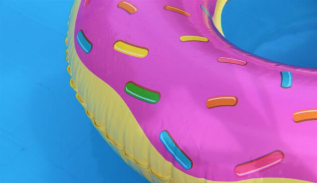 an inflatable doughnut floating in a pool