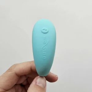 Rebecca Roberts' hand holding the We Vibe Sync Lite