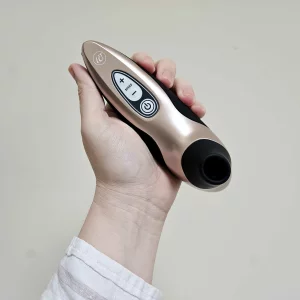 A first-hand picture of Mumsnet editor Rebecca's hand holding the Womanizer Pro40 against a wall