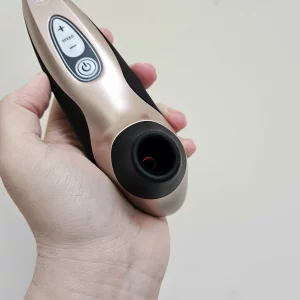 A first-hand picture of Mumsnet editor Rebecca's hand holding the Womanizer Pro40 against a wall