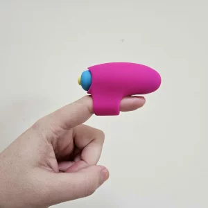 A hand models the Lovehoney Excite 10 Function Finger Vibrator