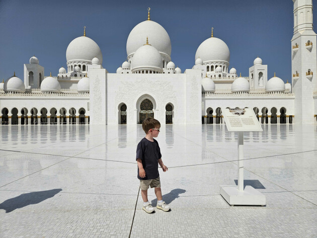 A view of my child standing inside Sheikh Zayed Grand Mosque in Abu Dhabi
