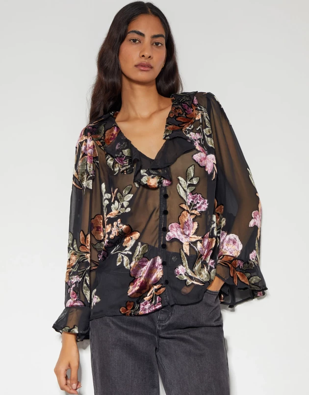 Model wears the Ariella floral devore blouse from Monsoon