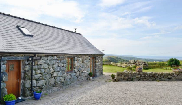 a stone barn conversion on a sunny day