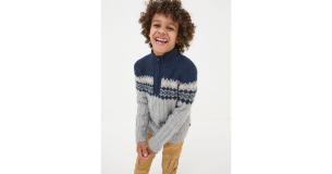 A child model wears FatFace's Grey Half Neck Jumper