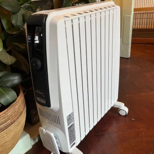 De'Longhi Dragon 4 TRDX41025E Oil Filled Radiator being hand tested by journalist Poppy O'Neill