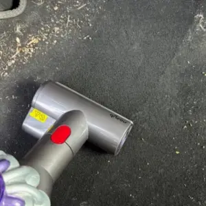 Mumsnet journalist Rachel Erdos testing the Dyson Car+Boat Handheld Vacuum Cleaner
