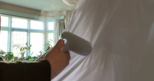 Mumsnet journalist Poppy O'Neill testing the Steamery Cirrus X Handheld Steamer