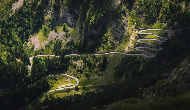 a winding road up a mountain in the pyrenees