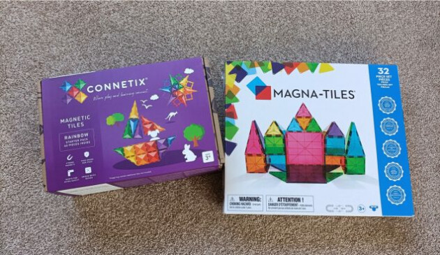 A box of Connetix magnetic tiles next to a box of Magna-Tiles