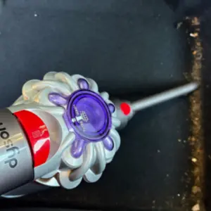 Mumsnet journalist Rachel Erdos testing the Dyson Car+Boat Handheld Vacuum Cleaner