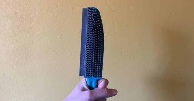 Mumsnet home editor Poppy O'Neill testing the Beldray Antibac Pet Plus+ Upholstery Brush