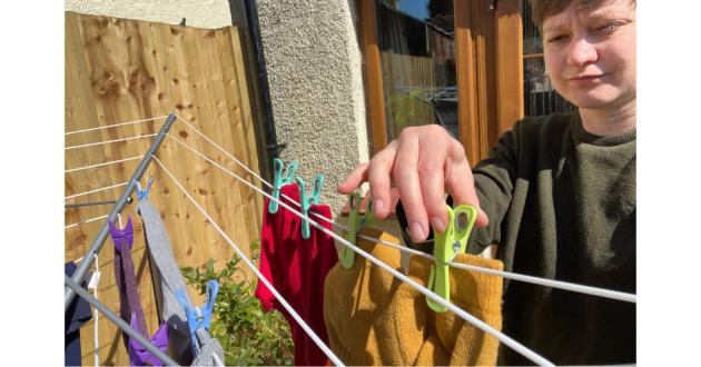 Mumsnet home editor Poppy O'Neill testing the Minky Freestanding Portable Rotary Airer